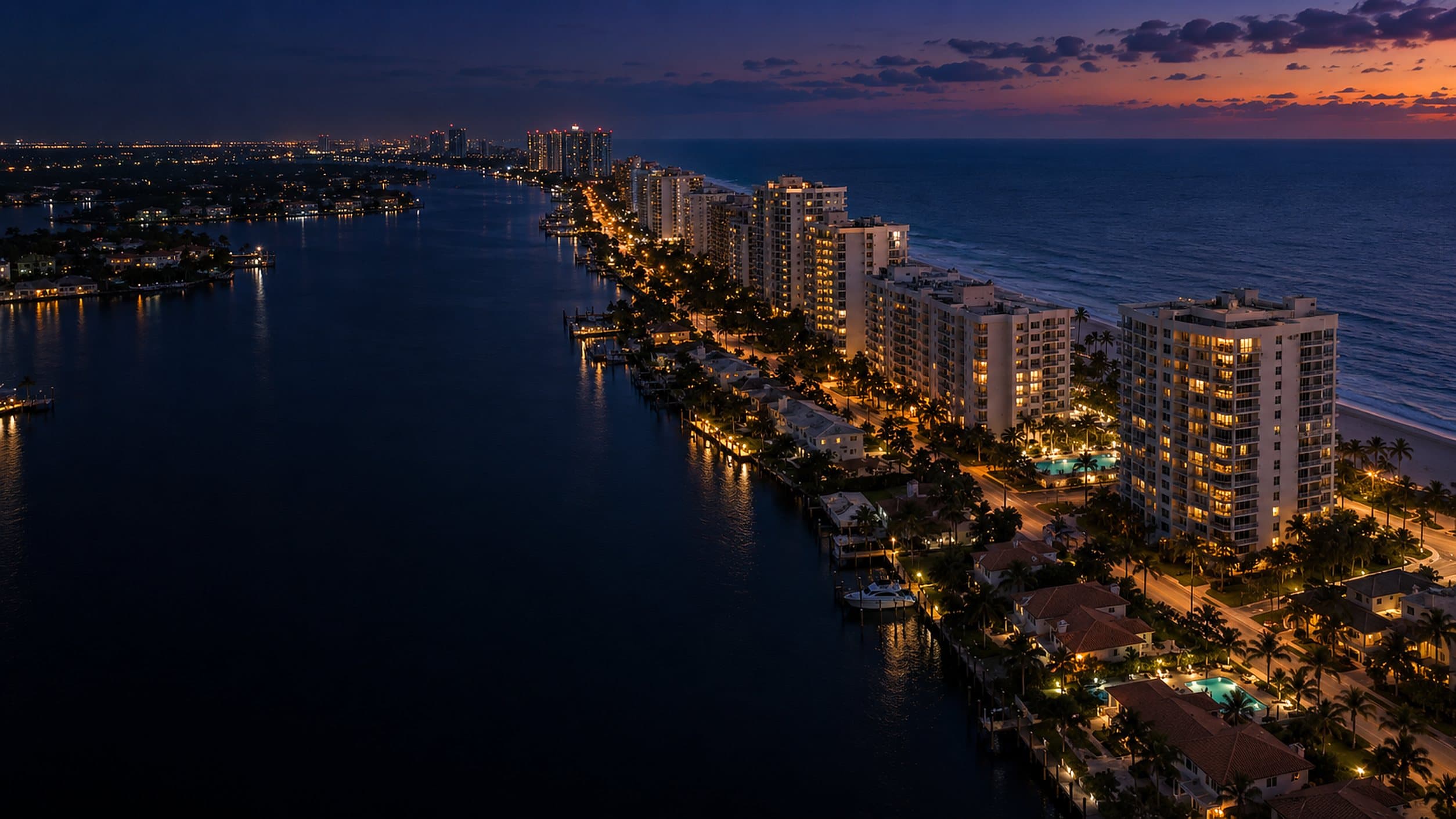 Coastal condominium towers and HOA communities along the Intracoastal at dusk in South Florida